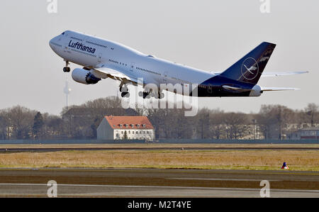 A Boeing 747-8 departs from the Tegel airport in Berlin, Germany, 8 February 2018. Lufthansa launches the redesign of their crane logo on the occasion of their 100th anniversary. Photo: Britta Pedersen/dpa Stock Photo