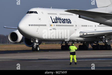 A Boeing 747-8 departs from the Tegel airport in Berlin, Germany, 8 February 2018. Lufthansa launches the redesign of their crane logo on the occasion of their 100th anniversary. Photo: Britta Pedersen/dpa Stock Photo