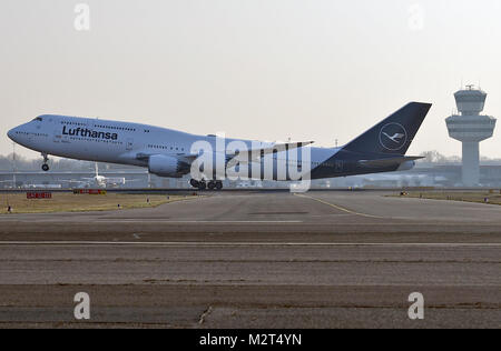 A Boeing 747-8 departs from the Tegel airport in Berlin, Germany, 8 February 2018. Lufthansa launches the redesign of their crane logo on the occasion of their 100th anniversary. Photo: Britta Pedersen/dpa Stock Photo