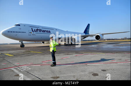 A Boeing 747-8 departs from the Tegel airport in Berlin, Germany, 8 February 2018. Lufthansa launches the redesign of their crane logo on the occasion of their 100th anniversary. Photo: Britta Pedersen/dpa Stock Photo