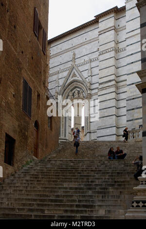 The steps down to the Baptistery and Piazza San Giovanni from the Piazza del Duomo, Siena, Tuscany, Italy Stock Photo