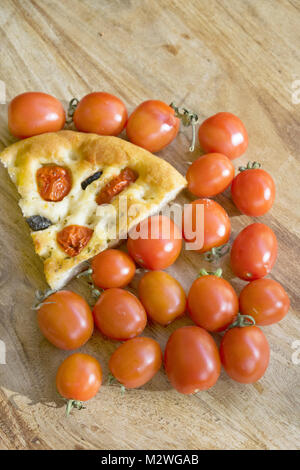 wedge of flatbread or focaccia with cherry tomatoes Stock Photo