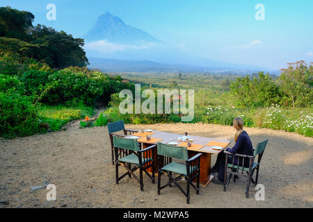 Breakfast at luxury camp overlooking a volcano in the Virunga National Park in the Democratic Republic of Congo, Africa, close to the border of Rwanda Stock Photo