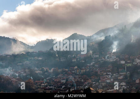 Early morning light in Sarajevo, Bosnia Hercegovina, Former Yugoslavia domestic fire smoke in surrounding hills Stock Photo