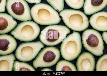 Persea americana. Avocado pattern on a slate background Stock Photo