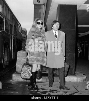 Sharon Tate, 23-year-old American actress and her bridegroom, Roman Polanski, as they left Heathrow Airport, London, for Paris. Stock Photo