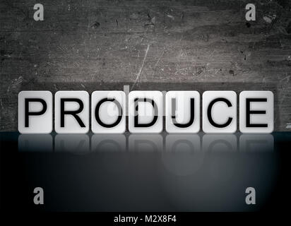 The word Produce concept and theme written in white tiles on a dark background. Stock Photo