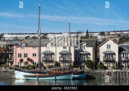 View across Bristol's Floating Harbour looking towards Pooles Wharf with the houses of Royal York Crescent, Clifton on the skyline. Stock Photo