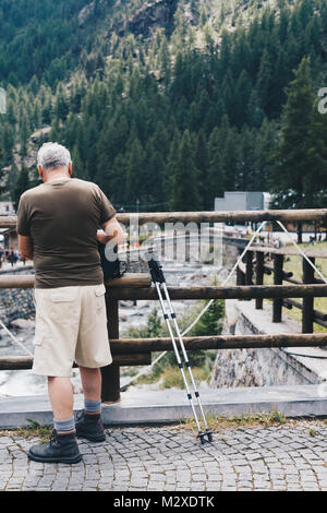 aged man preparing for hiking in Italy Stock Photo