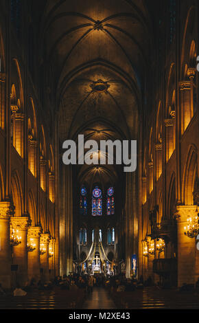 Paris, France - Nov 29, 2013: Interior view of Notre-Dame Cathedral, one of finest examples of French Gothic architecture in Paris. Construction began Stock Photo