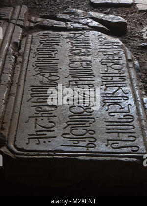 Noravank Monastery in southern Armenia, gravestone with inscription in the Armenian alphabet Stock Photo