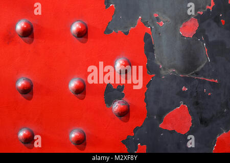 red metal plate background - riveted industrial steel Stock Photo