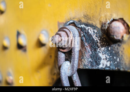 rusty chain on rusted nut closeup - industrial detail  - Stock Photo