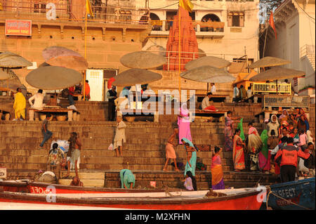 Devotees on the banks of the river Ganges take a holy dip in Varanasi, India Stock Photo