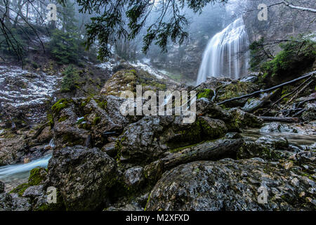 Winter scene displaying one of the majestic waterfalls in the natural amphitheater located at the east end of the Chartreuse mountain range, in the Fr Stock Photo