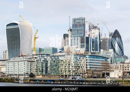 The dense commercial development of the City of London skyline seen across the River Thames. Stock Photo