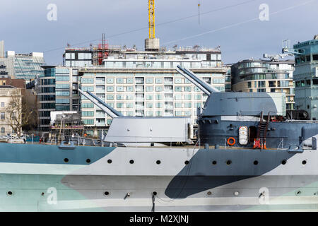 The forward guns of HMS Belfast are famously trained on the Scratchwood Services, now London Gateway service station, on the M1 12.5 miles away. Stock Photo