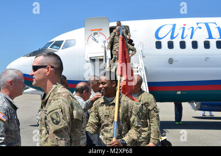 BATON ROUGE, La. – Friends and family welcome home the Louisiana National Guard’s 926th Engineer Company ending a 365-day deployment in Afghanistan at the Baton Rouge Metropolitan Airport in Baton Rouge, La., April 14. The Baker-based unit, with approximately 100 Soldiers, conducted route clearance and combat-engineer operations to maintain safe travel for United States Forces – Afghanistan and ISAF Forces in support of Operation Enduring Freedom. (U.S. Army photo by Staff Sgt. Denis B. Ricou, Louisiana National Guard Public Affairs Office / Released) 120414-A-RG802-042 by Louisiana National G Stock Photo