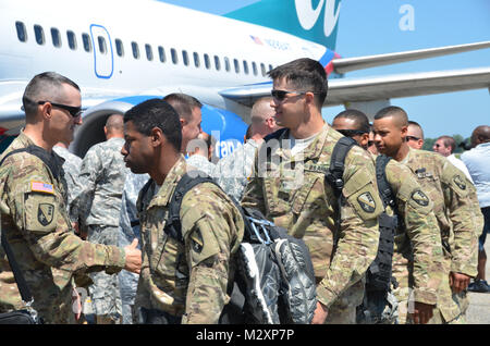 BATON ROUGE, La. – Friends and family welcome home the Louisiana National Guard’s 926th Engineer Company ending a 365-day deployment in Afghanistan at the Baton Rouge Metropolitan Airport in Baton Rouge, La., April 14. The Baker-based unit, with approximately 100 Soldiers, conducted route clearance and combat-engineer operations to maintain safe travel for United States Forces – Afghanistan and ISAF Forces in support of Operation Enduring Freedom. (U.S. Army photo by Staff Sgt. Denis B. Ricou, Louisiana National Guard Public Affairs Office / Released) 120414-A-RG802-061 by Louisiana National G Stock Photo