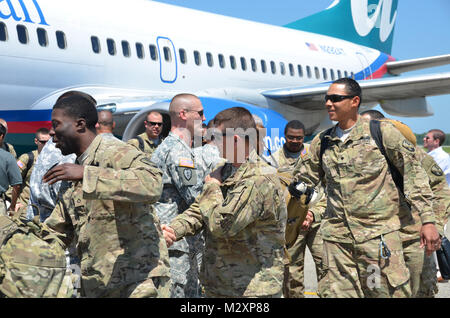 BATON ROUGE, La. – Friends and family welcome home the Louisiana National Guard’s 926th Engineer Company ending a 365-day deployment in Afghanistan at the Baton Rouge Metropolitan Airport in Baton Rouge, La., April 14. The Baker-based unit, with approximately 100 Soldiers, conducted route clearance and combat-engineer operations to maintain safe travel for United States Forces – Afghanistan and ISAF Forces in support of Operation Enduring Freedom. (U.S. Army photo by Staff Sgt. Denis B. Ricou, Louisiana National Guard Public Affairs Office / Released) 120414-A-RG802-068 by Louisiana National G Stock Photo