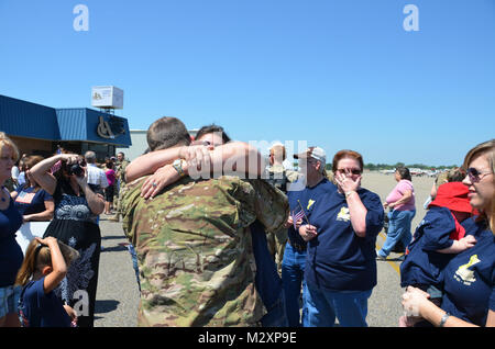 BATON ROUGE, La. – Friends and family welcome home the Louisiana National Guard’s 926th Engineer Company ending a 365-day deployment in Afghanistan at the Baton Rouge Metropolitan Airport in Baton Rouge, La., April 14. The Baker-based unit, with approximately 100 Soldiers, conducted route clearance and combat-engineer operations to maintain safe travel for United States Forces – Afghanistan and ISAF Forces in support of Operation Enduring Freedom. (U.S. Army photo by Staff Sgt. Denis B. Ricou, Louisiana National Guard Public Affairs Office / Released) 120414-A-RG802-085 by Louisiana National G Stock Photo