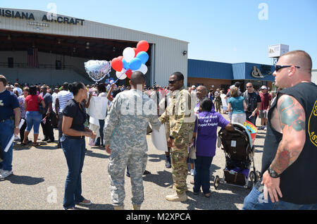 BATON ROUGE, La. – Friends and family welcome home the Louisiana National Guard’s 926th Engineer Company ending a 365-day deployment in Afghanistan at the Baton Rouge Metropolitan Airport in Baton Rouge, La., April 14. The Baker-based unit, with approximately 100 Soldiers, conducted route clearance and combat-engineer operations to maintain safe travel for United States Forces – Afghanistan and ISAF Forces in support of Operation Enduring Freedom. (U.S. Army photo by Staff Sgt. Denis B. Ricou, Louisiana National Guard Public Affairs Office / Released) 120414-A-RG802-113 by Louisiana National G Stock Photo