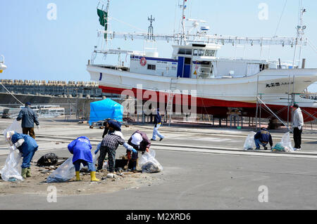 A ship rests as military members and their dependents joined members from the local community to clean up the Misawa City Port in Misawa City, Japan, April 21, 2012. The event was led by Misawa City and the 35th Civil Engineer Squadron environmental management office to encourage public interest in protecting the environment in recognition of Earth Day. (U.S. Air Force photo by Tech. Sgt. Marie Brown/Released) Local community to clean up the Misawa City Port by #PACOM Stock Photo