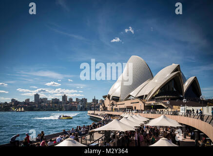 sydney opera house and harbour promenade outdoor cafes in australia on sunny day Stock Photo