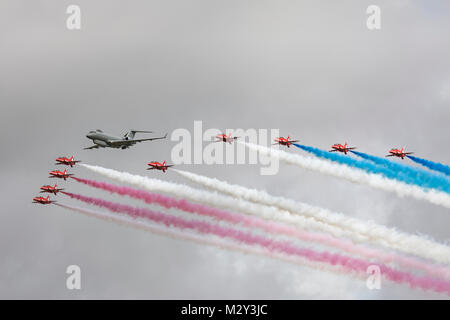 Royal Air Force Red Arrows flying in formation with a Sentinel R1 Stock Photo