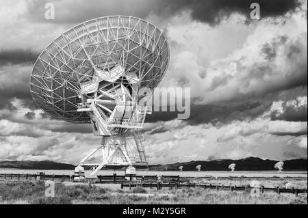 Black & White Photograph of a Very Large Array (VLA) Radio Telescope located at the National Radio Astronomy Observatory Site in Socorro, New Mexico. Stock Photo