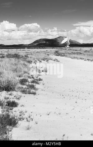 Black & White Photograph of a Very Large Array (VLA) Radio Telescope located at the National Radio Astronomy Observatory Site in Socorro, New Mexico. Stock Photo