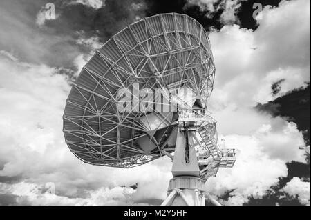 Black & White Photograph of a Very Large Array (VLA) Radio Telescope located at the National Radio Astronomy Observatory Site in Socorro, New Mexico. Stock Photo