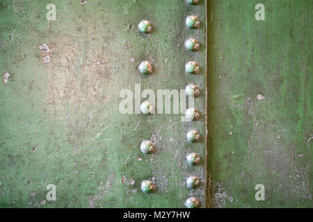 abstract metal background - iron texture with rivets - riveted steel Stock Photo
