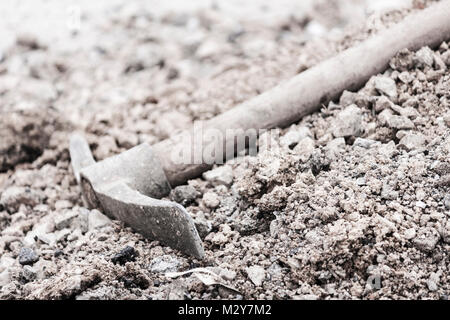 Pickaxe at ground Stock Photo
