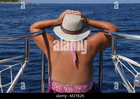 An english lady relaxing while on a boat trip around the bays at fethiye in turkey, 2017 Stock Photo