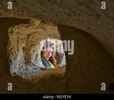 Tourist girl in Cappadocia cave Stock Photo