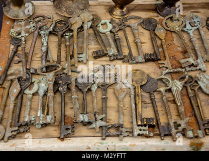 old keys on a wooden table, close-up Stock Photo