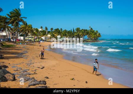 Surfer on Luquillo beach Puerto Rico, Caribbean Stock Photo