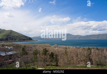 Lake Sevan in Armenia at an altitude of altitude of 1,900 m, the largest fresh water reserve in the area, panorama view, shoreline, trees and hills Stock Photo