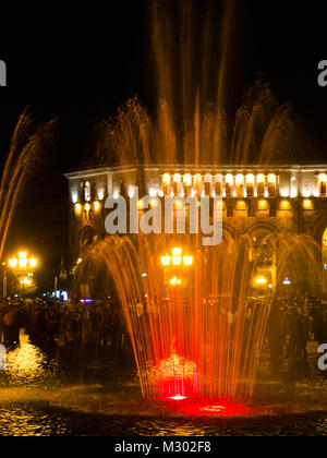 The Republic Square in Yerevan Armenia at night features a musical fountain, also called dancing fountain with changing light and water features Stock Photo