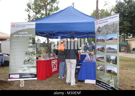 Norfolk District employees Vincent Cotton and Gregory Headen (foreground) staff the district’s exhibit at the annual Hampton University Military Appreciation Day football extravaganza Sept 29, at Armstrong Stadium on the campus of Hampton University, Hampton, Va. Members of Norfolk District were on hand to promote the district’s mission and talk about job opportunities available to students attending the university football game. The fete was sponsored by Hampton University and military forces throughout Hampton Roads – US Army, US Navy, US Air Force, US Coast Guard and US Marines – to salute  Stock Photo