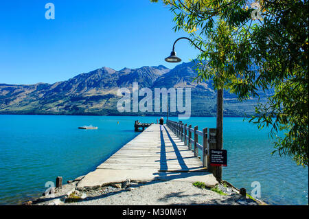 Wooden pier in the turquoise water of Lake Wakaipu, Glenorchy around Queenstown, South Island, New Zealand
