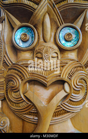 Traditional wood carved mask in the Te Puia Maori Cultural Center, Roturura, North Island, New Zealand Stock Photo