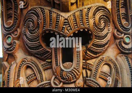 Traditional wood carved mask in the Te Puia Maori Cultural Center, Roturura, North Island, New Zealand Stock Photo