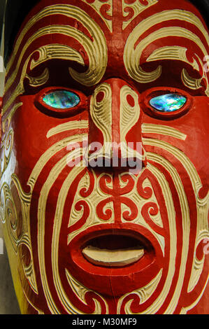 Traditional wood carved mask in the Te Puia Maori Cultural Center, Roturura, North Island, New Zealand Stock Photo