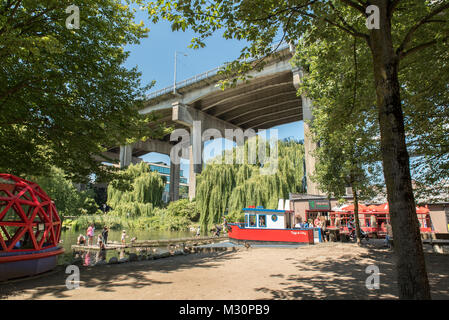 Vancouver, British Columbia, Canada.  Sutcliffe Park at the south end of Granville Island with Granville Street Bridge in background. Stock Photo