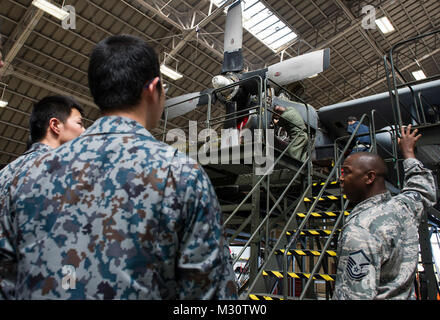 Assistant Maintenance Flight Chief, Explains To Japan Air Self-Defense Force Maintenance Officer Cadets The Mechanical Work Being Performed On The Propeller Of A C-130 Hercules by #PACOM Stock Photo