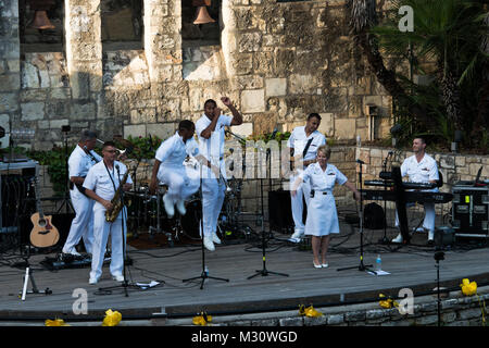140519-N-HG258-094 SAN ANTONIO, TEXAS (May 19, 2014) The Navy Band Cruisers perform during an afternoon concert at the Arneson River Theater on the riverwalk in San Antonio, Texas.  The U.S. Navy Band Cruisers, based in Washington and led by Senior Chief Musician Leon Alexander, is currently on an 12-day tour of Texas. One of the band's primary responsibilities, national tours increase awareness of the Navy in places that don't see the Navy work on a regular basis. (U.S. Navy photo by MUC Stephen Hassay/Released) 140519-N-HG258-094 by United States Navy Band Stock Photo