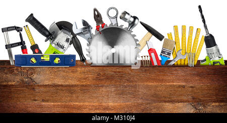 DIY tools collage concept behind wooden plank with copy space and circular saw blade isolated on white wide panorama background Stock Photo