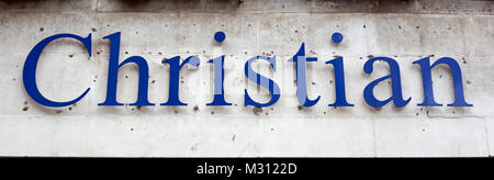 A sign in blue reading 'Christian' on a light stone background Stock Photo